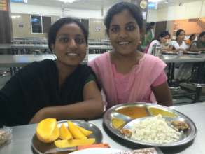 Maya (L) living the dream. Little sis looks proud