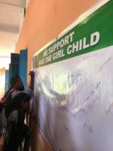 Students at one of SOVA's Programs sign a petition
