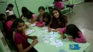 Girls making Christmas Cards
