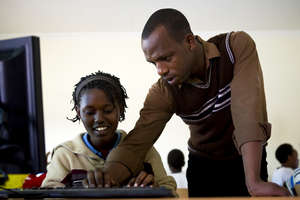 A student learns how to use a computer
