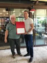 Mr.Yalcn is getting certificate from Mr.Aygunduz