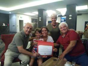 Mrs.Senol gets her donation certificate