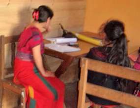 The teacher gives individual instruction
