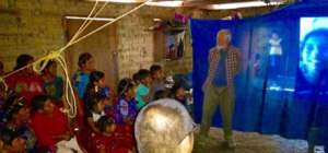Chel families see photos of scholars at Ak Tenamit