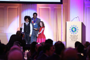 Iyyappan receiving the Award from the Children