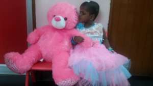 Kissing the Teddy she was gifted on her birthday