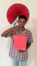 Displaying the bag he made entirely on his own!