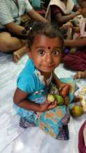 Sharing fruits with Gypsy children