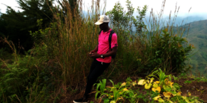Survey team member, measuring a farm with GPS.
