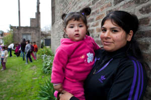Woman with her child in garden