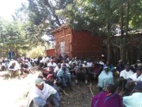 Farmers participate in a training on tree planting