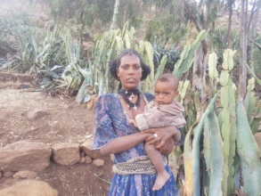 Tree planting worker Weresech with her child