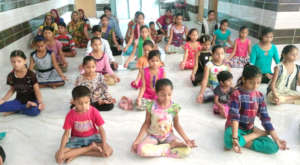 Girls are doing yoga during awareness session