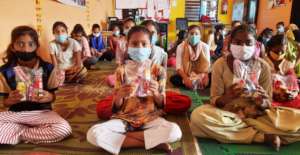 Girls with hygiene kits