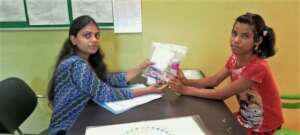 Meenu is receiving hygiene kit