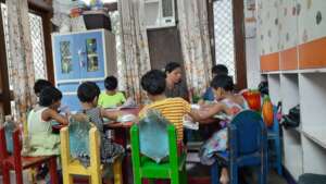 Kids discussing home work with their teacher