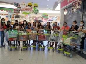 The women shopping for supplies for their families