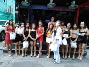 Mothers receiving gifts during Outreach