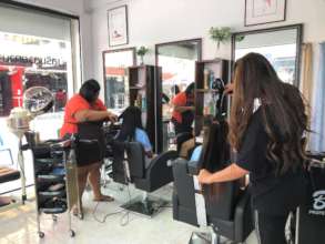 Women receiving free hair treatment