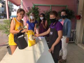 Woman receiving food bag
