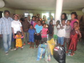 Project team donate food item to ophange children