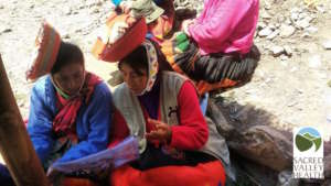 Teresa (right) teaching another CHW