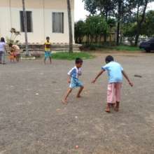 Playing football with his friend Phi