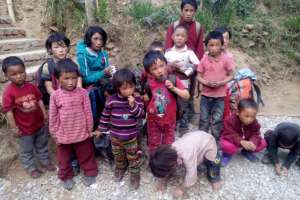 Young children in a transit home following quake