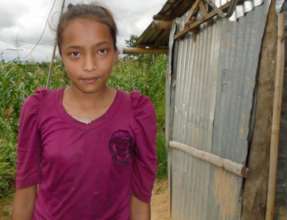 Sita in front of her house