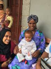 Our Volunteer Nia with one of our young patients