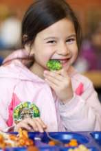 Girl Eating Broccoli
