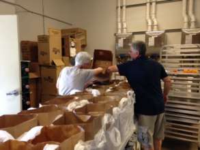PCS Delivery Volunteers Help Pack Client Food Bags