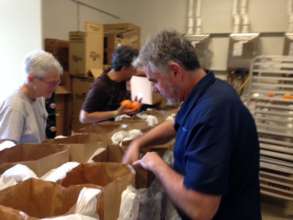 PCS Delivery Volunteers Help Pack Client Food Bags