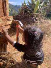 Aliyah hard at work with mud and hammer