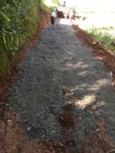 First load of gravel to help protect the road