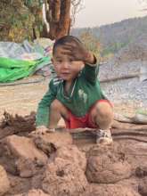 Playing in the mud-building our house!