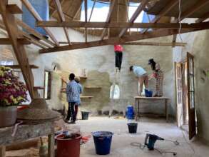 Interns working on lime plaster and lime wash
