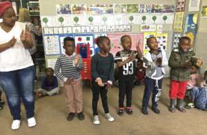 Preschool children singing and moving to a song