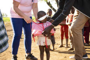 Young Aphiwe receiving new clothes