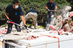 IsraAID's team cleaning up after the floods