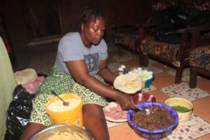 Fatmata making food at her business