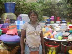 Woman retailing plastic bowls and buckets