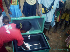 Solar box cooker with cooking pot (and teacher)