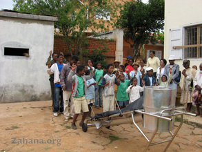 The BlazinTubeSolar cooker being assembled with an