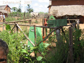 Communal water faucet keeps the garden green