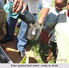 Solar pasteurized water in poured into a cup