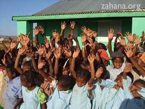 Student in front of the school