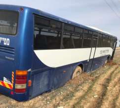 School bus stuck in mud on the Al-Fur'a road
