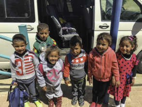 Preschoolers getting on the bus
