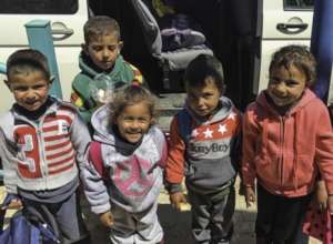 Children going on the bus to preschool